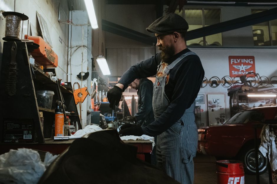 Auto glass technician performing expert chip repair on a windshield